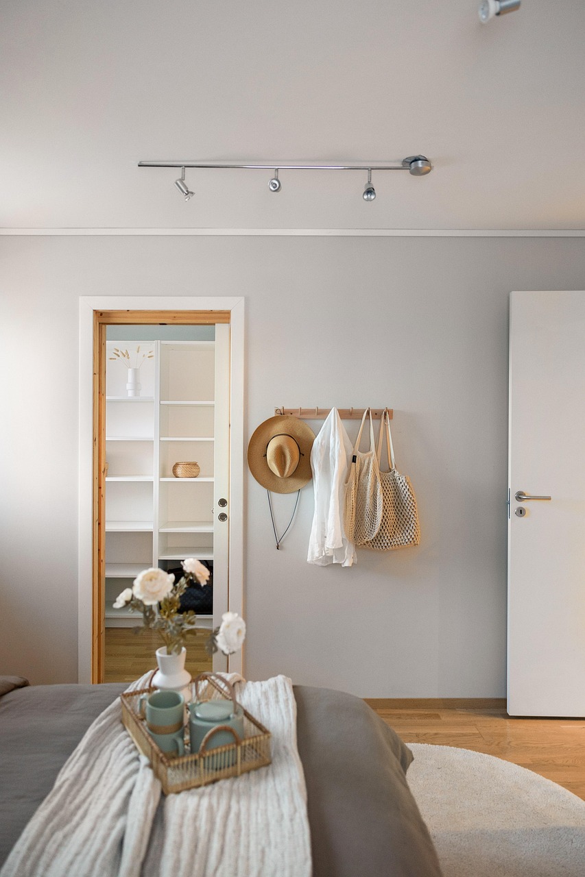 Calm bedroom with soft sage green bedding and wood nightstands
