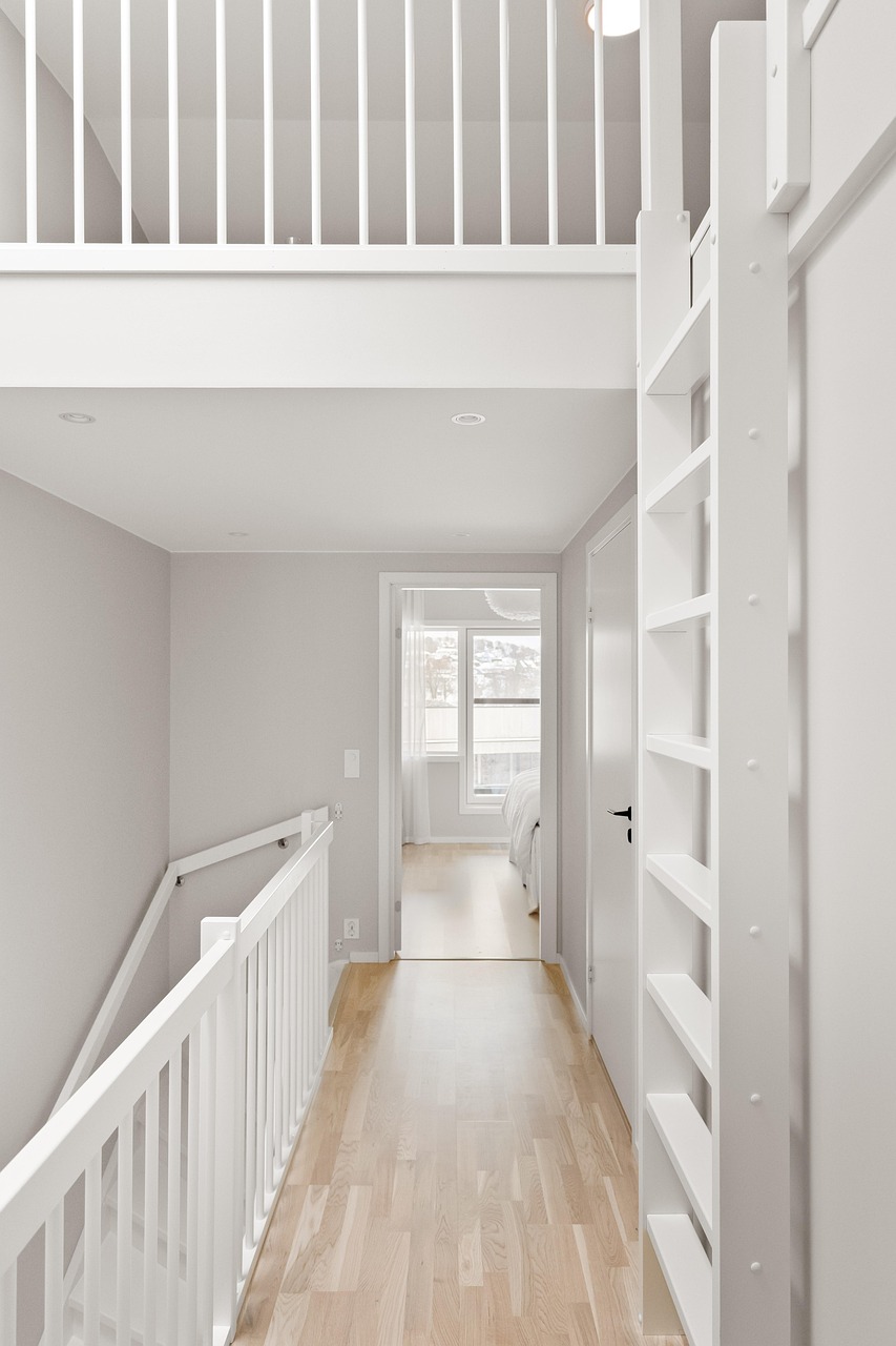 Narrow hallway styled with a slim console table and a wall mirror
