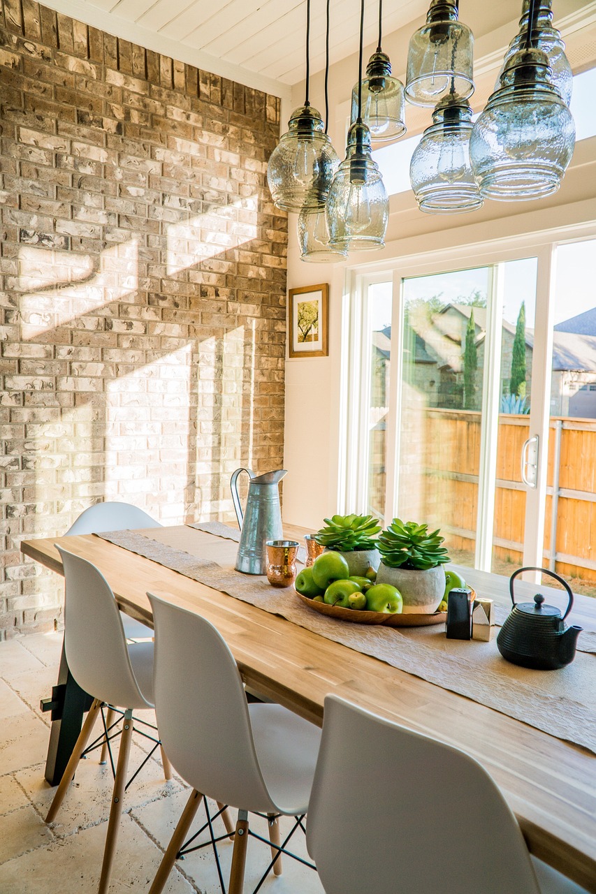 Kitchen corner with a pendant light hanging over a small breakfast table