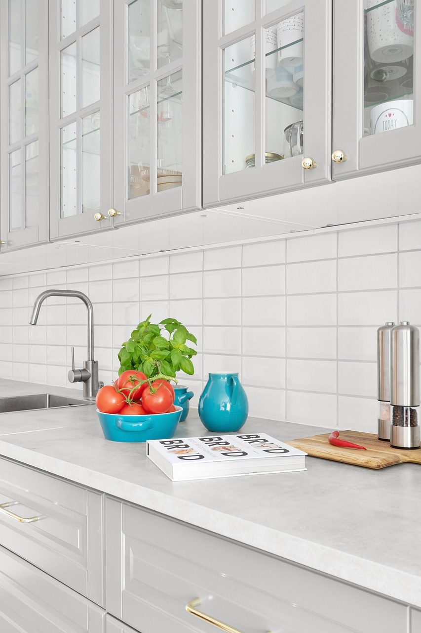 Bright small kitchen with a light backsplash and under-cabinet lighting