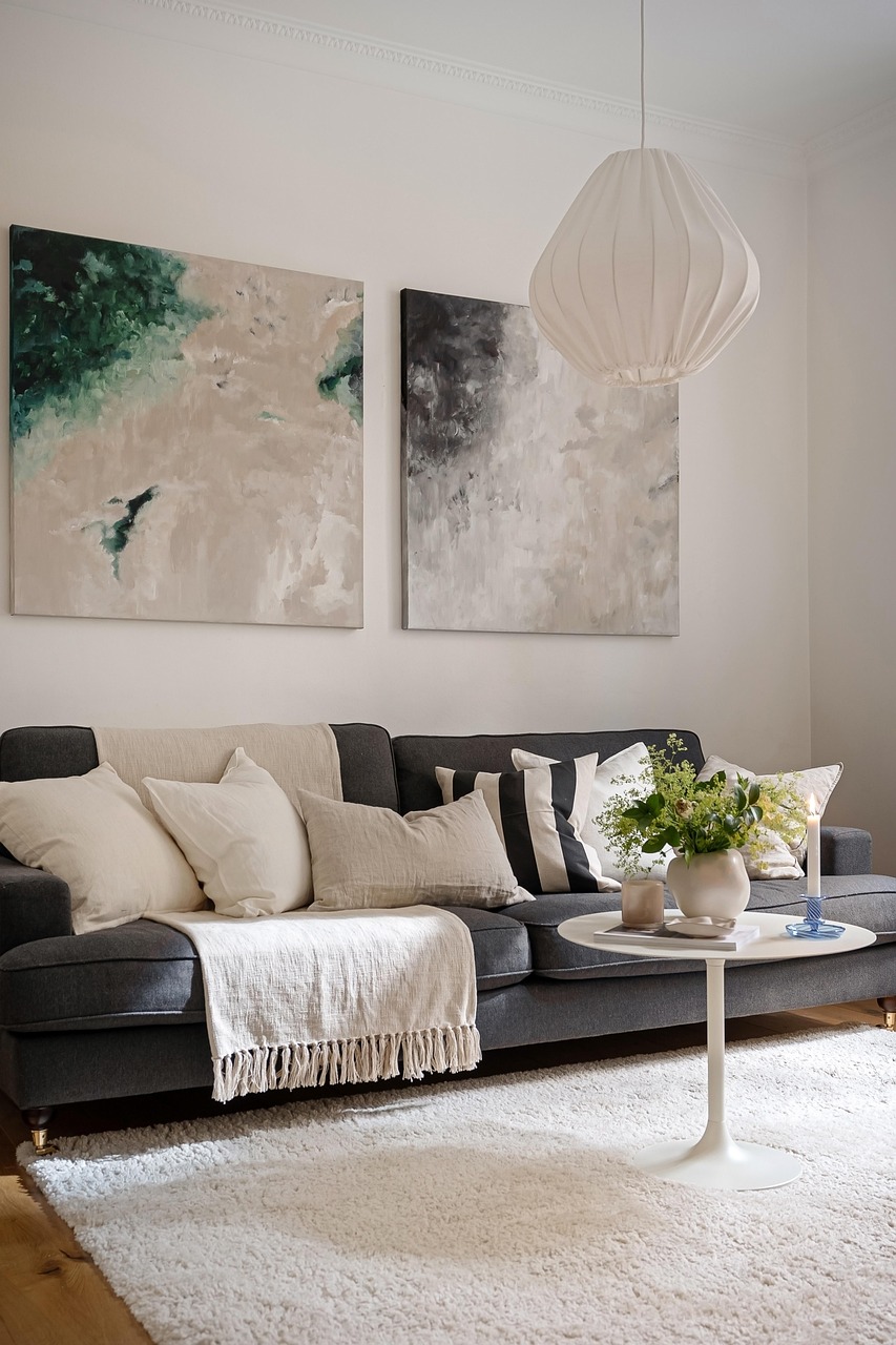 Neutral living room with a single accent chair, side table and soft natural light
