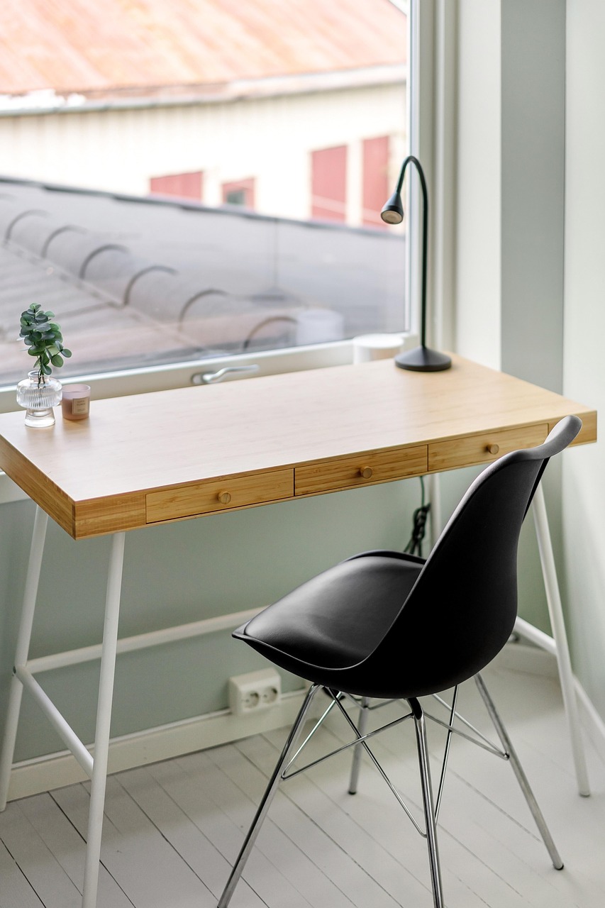 Cozy home office with a warm wood desk and open shelving