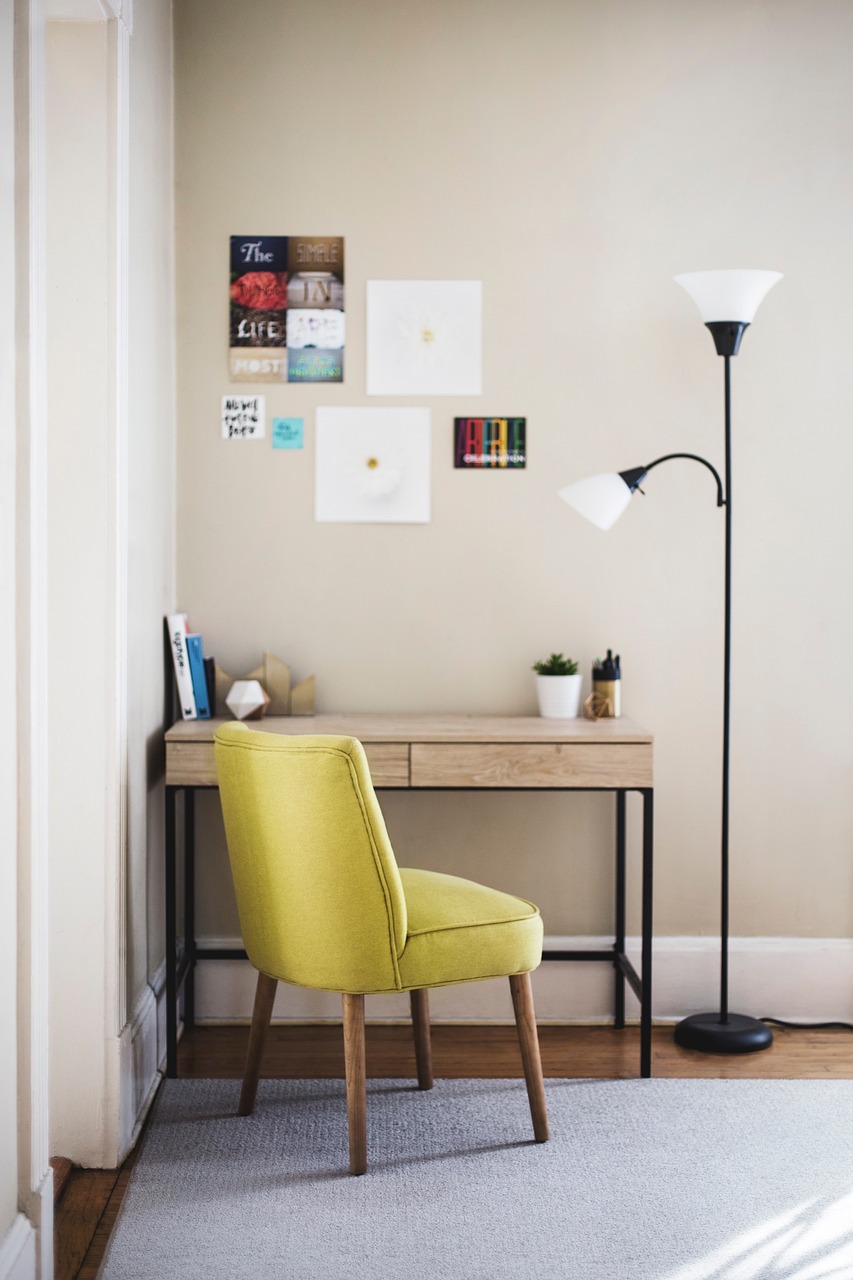 Home office desk with a task lamp and a soft area rug underfoot